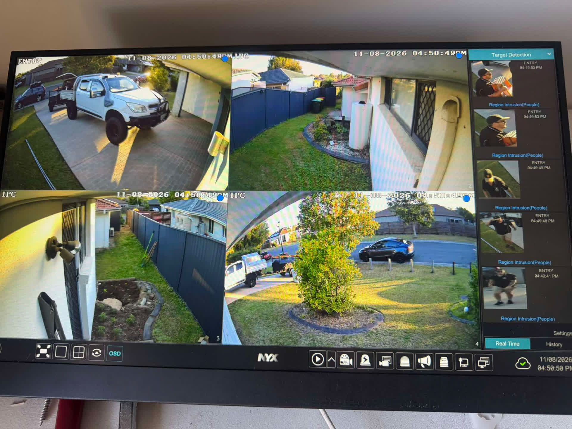 Monitor showing four live CCTV views and detection thumbnails