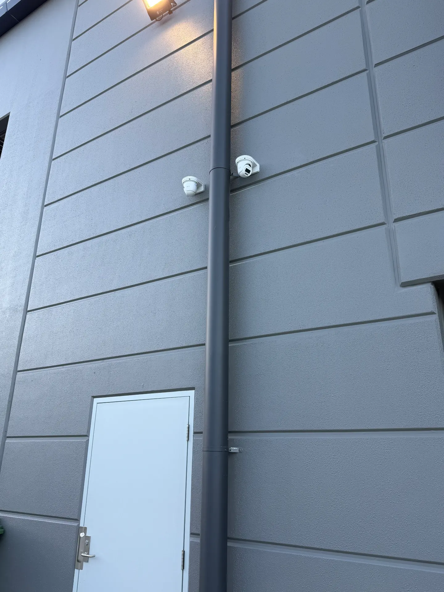 Twin CCTV cameras installed above a commercial entry on the Gold Coast