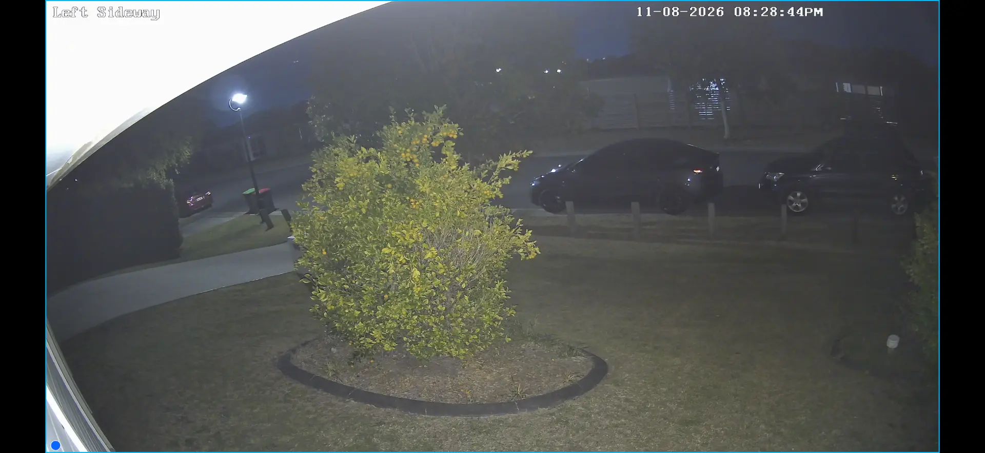 Night CCTV view covering a side path, front yard and gate line
