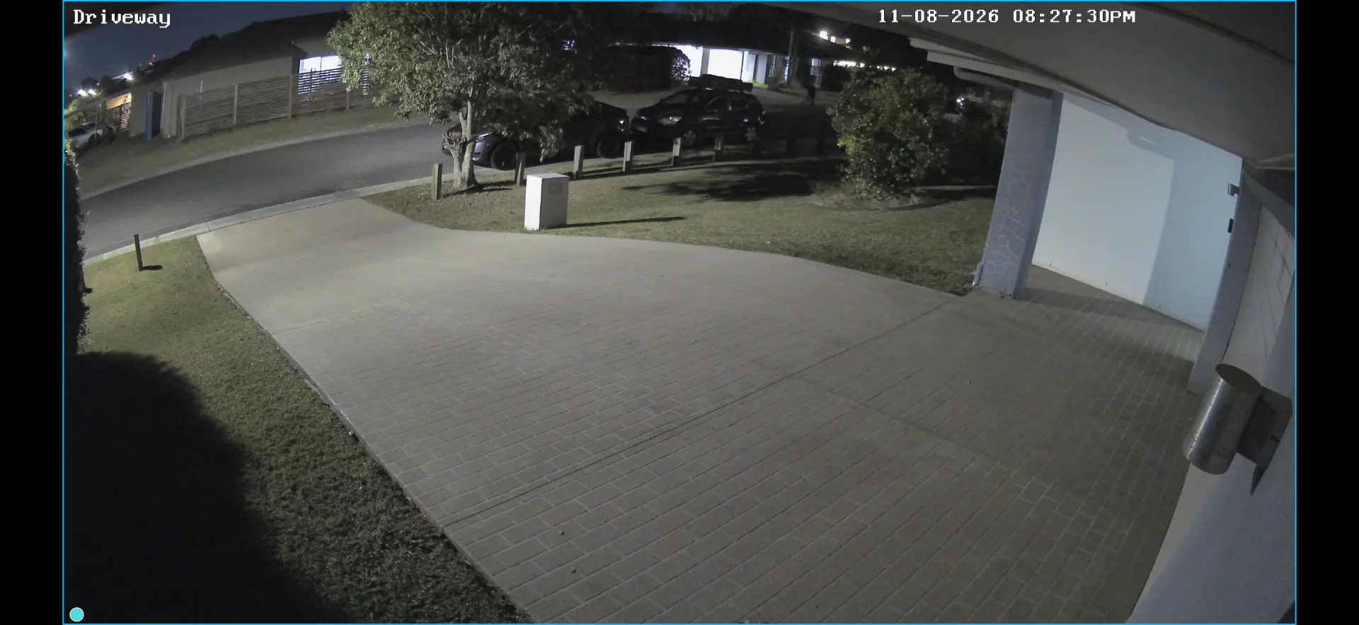 Night CCTV view covering a residential driveway and garage
