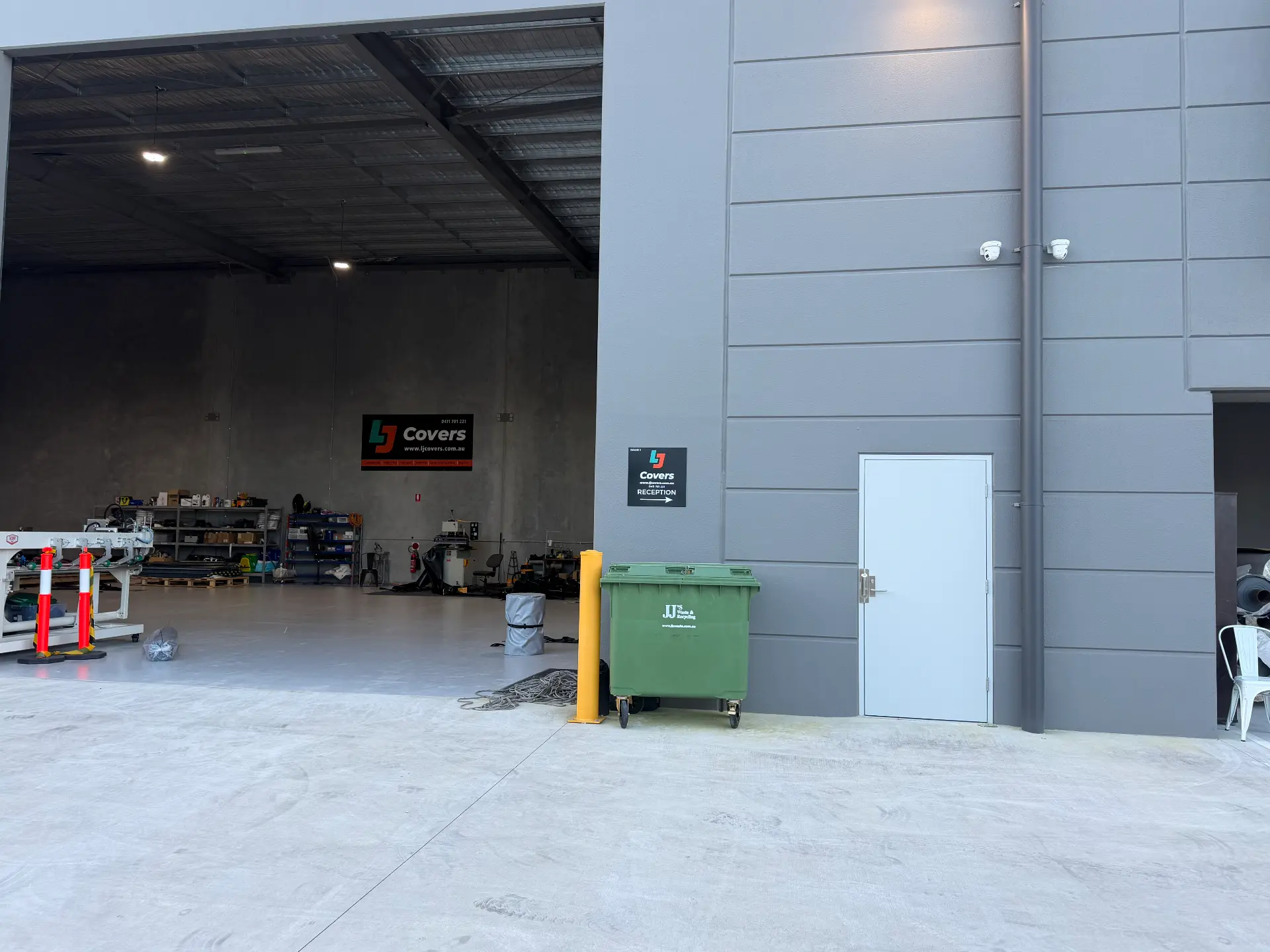 CCTV cameras mounted above a warehouse roller door
